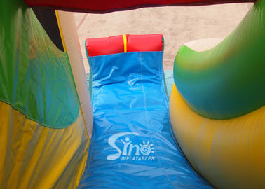 Custom made outdoor tropical inflatable combo castle with slide made of lead free pvc tarpaulin