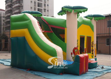 Custom made outdoor tropical inflatable combo castle with slide made of lead free pvc tarpaulin